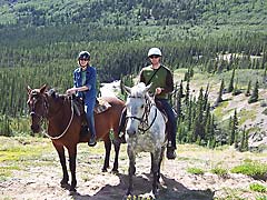 Couple horseback riding in the Yukon